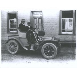 Two Men and a Dog in a Car