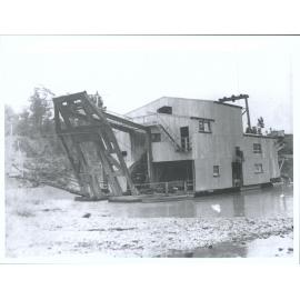 Man and dog on dredge at New River