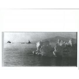 Iceberg and ships in the distance