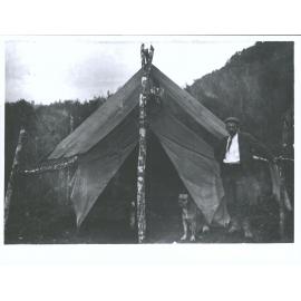 Unidentfied Man and dog outside Surveyor's Hut