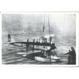 Seaplane being lifted by crane