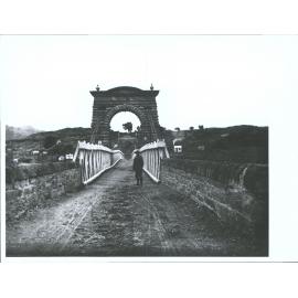 [Man stands on Alexandra Bridge]