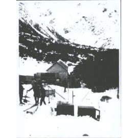 shoveling snow by the dog kennels