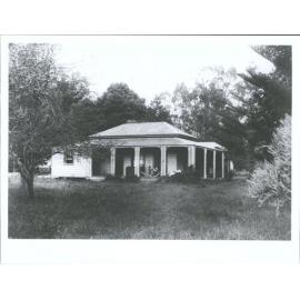 Family homestead at Otahuhu with R. B. W. in front of rocking horse