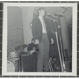 Male vocalist performing with supporting instrumentalists at the 'Folk Proms Concert Capping '67', Union Hall, Dunedin