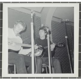 Duo with guitars performing at the 'Folk Proms Concert Capping '67', Union Hall, Dunedin