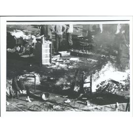 "Prison equipment being burnt by prisoners to keep warm"