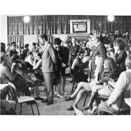 'In the main canteen of the University Union, The Prince of Wales, Miss Laraine Waters (OUSA), Princess Anne, Mr P.J. O'Dea (N.Z. Director of royal tour)'