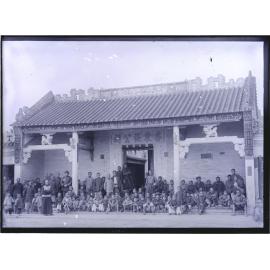 Group on front verandah of a village temple or hall