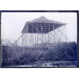 Mat house being built in orchard