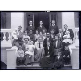 A group of European people on entrance steps