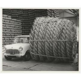 Large roll of rope next to Mini car