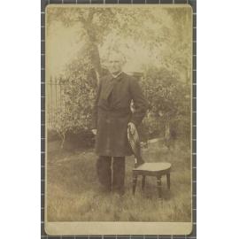 Donald McNaughton Stuart standing outdoors