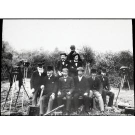 Group of men with cameras and photographic equipment