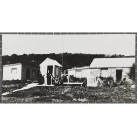 Two Swinney brothers and other unidentified people outside the post office, Cambrians