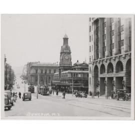 'Dunedin, N.Z.', a view of Princes Street including the Exchange and Chief Post Office buildings