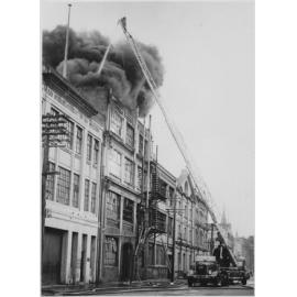 Fire scene at Coulls Somerville Wilkie Limited, Vogel Street, with engine and ladder at scene