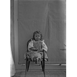 Vera McGeorge sitting in a chair