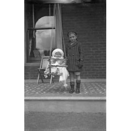 Alison McGeorge in swing on side verandah and Fred McGeorge