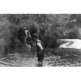 Young men swimming