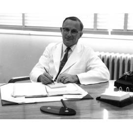 Sir John Walsh at his desk