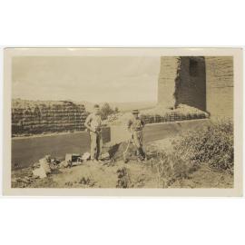 Two men digging