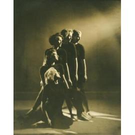 Five women in dance pose, arms lowered