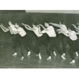 Six dancers, leaning over to left