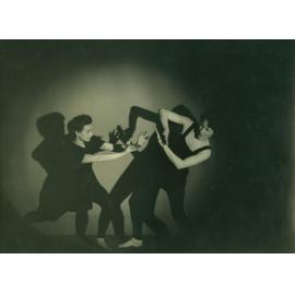 Two dancers, facing each other