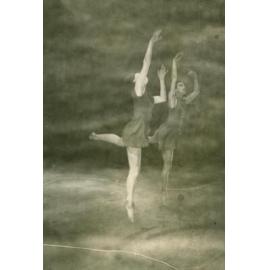 Two dancers facing right