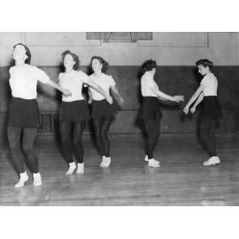 A group of three facing front/left and two facing each other