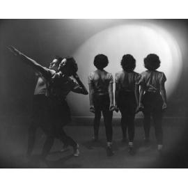 Dancers, two facing left and three facing away from camera