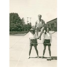 Philip Smithells and two women in outdoor gymnastic demonstration