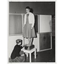 A student, Alison Bell, the well-known swimmer, has her feet examined by senior students in the Clinic for Individual Physical Education