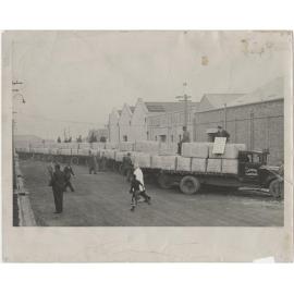 Trucks and carts loaded with a record shipment of rabbit skins