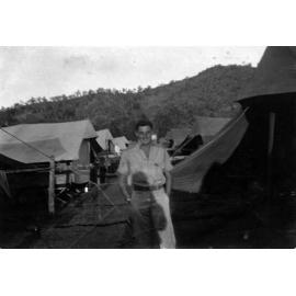 Man in front of camp