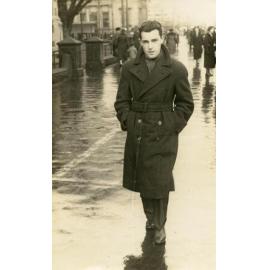 Keith Hulme standing on street in rain