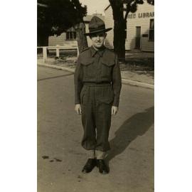 Soldier standing in front of free library