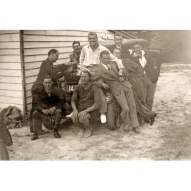 Group of men around car