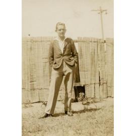 Standing in front of fence