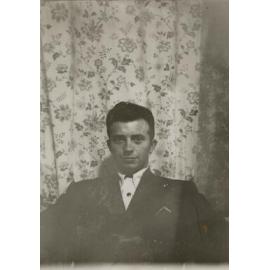 Portrait of man against wallpaper II