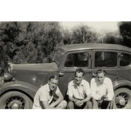 Three men with car