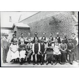 Workers in front of a brick building [Mosgiel Woollen Mills]