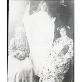 Three unidentified women in costume