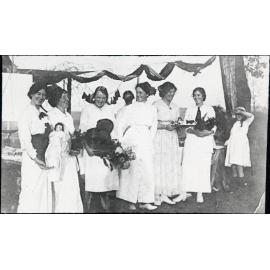 Group of young women at community fair or similar