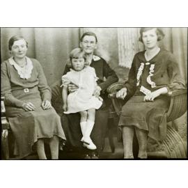 Three women and young child