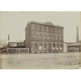 Dunedin premises of Reid and Gray from Crawford Sreet, showing frontage, warehouse, and office