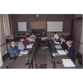People using the University Extension conference room, 'Salmon (Jack) U.E. Teleconference Equipment'