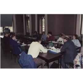 People using the University Extension conference room, 'Salmon (Jack) U.E. Teleconference Equipment'
