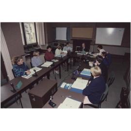 People using the University Extension conference room, 'Salmon (Jack) U.E. Teleconference Equipment'